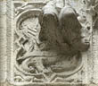 Panel 13:13 - Cockatrice (squeezed in below legs of string-course stop figure)